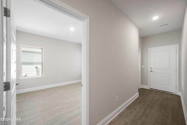 hallway featuring dark hardwood / wood-style flooring