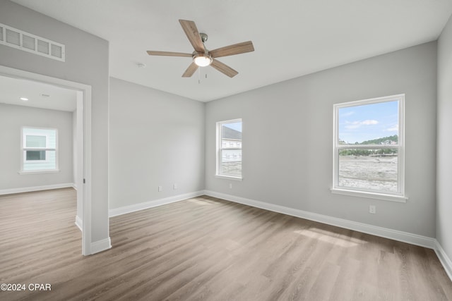 164 Canvas Ln Unit 72, Port St Joe, FL 32456 - unfurnished room featuring wood finished floors, healthy amount of natural light, and ceiling fan