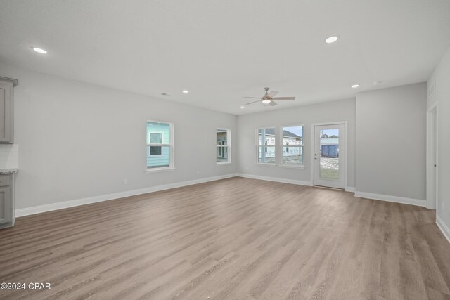 164 Canvas Ln Unit 72, Port St Joe, FL 32456 - unfurnished living room with a ceiling fan, plenty of natural light, recessed lighting, and light wood-style flooring