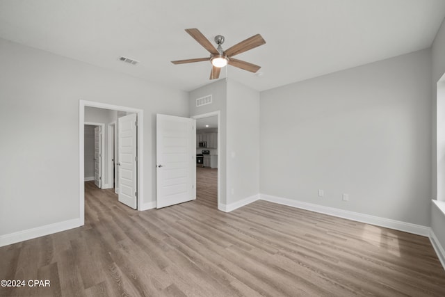 unfurnished bedroom featuring ceiling fan and light hardwood / wood-style floors