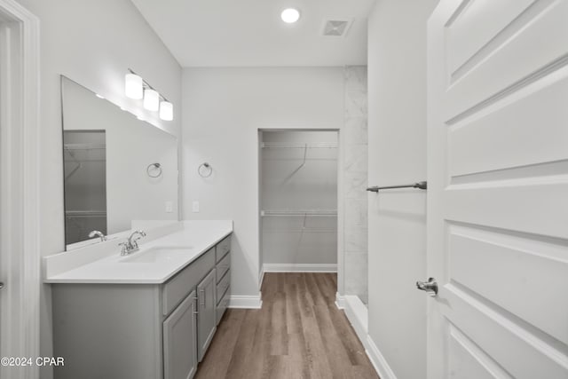 164 Canvas Ln Unit 72, Port St Joe, FL 32456 - full bath featuring vanity, wood finished floors, a spacious closet, and recessed lighting