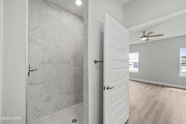 164 Canvas Ln Unit 72, Port St Joe, FL 32456 - full bathroom with tiled shower, plenty of natural light, wood finished floors, and a ceiling fan