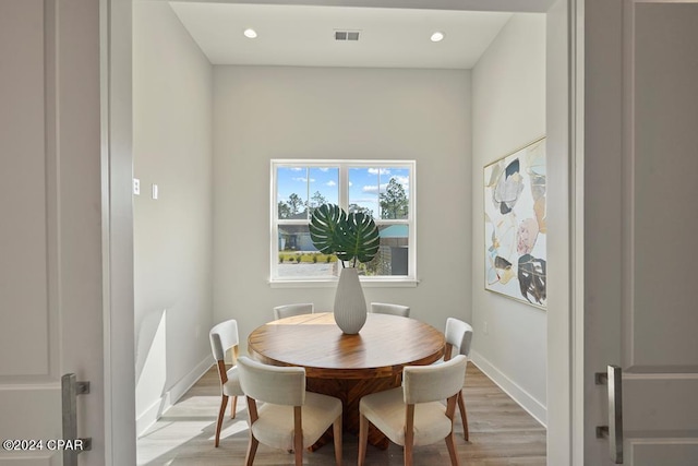 dining space with light wood-type flooring