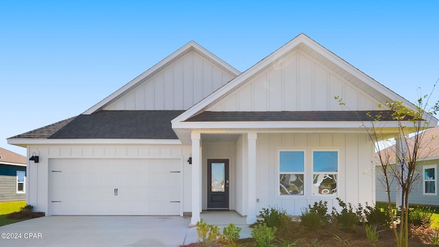 modern inspired farmhouse featuring board and batten siding and concrete driveway