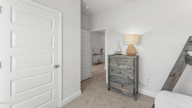 bedroom with light carpet