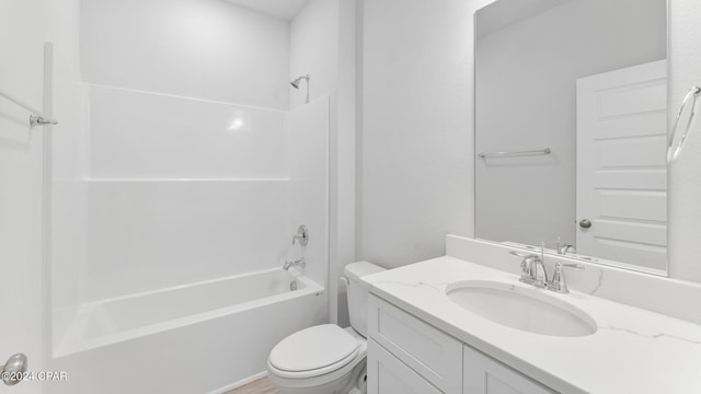 full bathroom with vanity,  shower combination, and toilet