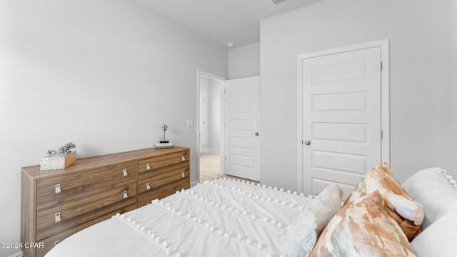 bedroom featuring a closet and hardwood / wood-style floors