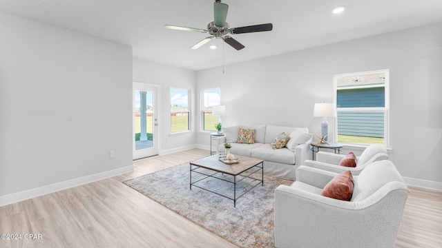 living room featuring ceiling fan, baseboards, wood finished floors, and recessed lighting