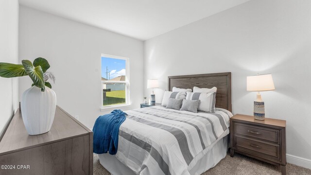 unfurnished bedroom with light colored carpet