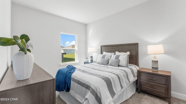 bedroom with light colored carpet