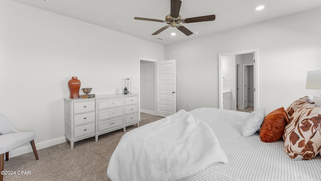 bedroom featuring recessed lighting, light carpet, a ceiling fan, baseboards, and ensuite bath