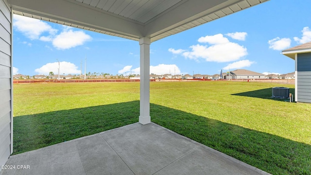 view of yard with a patio area and central AC unit