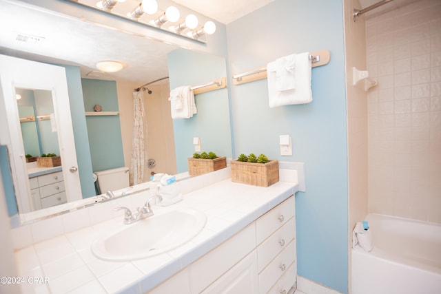 full bathroom featuring shower / bath combo, vanity, and toilet