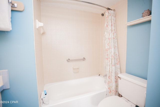 bathroom with toilet and shower / bath combination with curtain