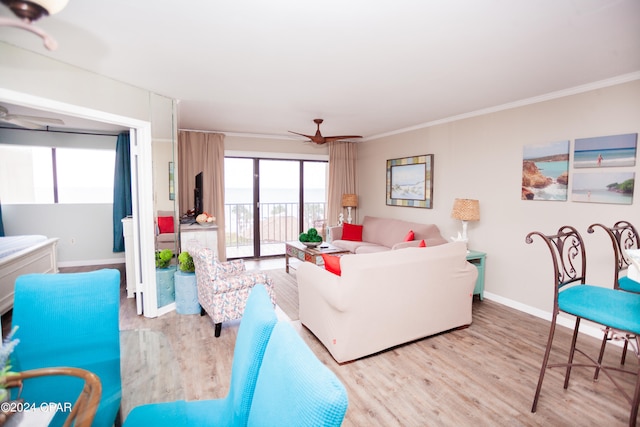 living room featuring light hardwood / wood-style flooring, ceiling fan, and ornamental molding