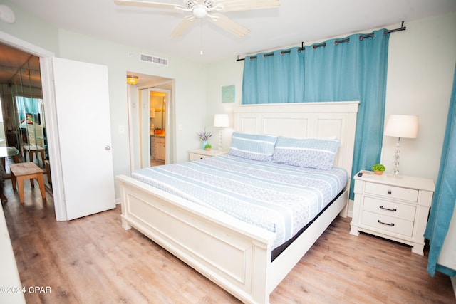 bedroom featuring light hardwood / wood-style floors and ceiling fan