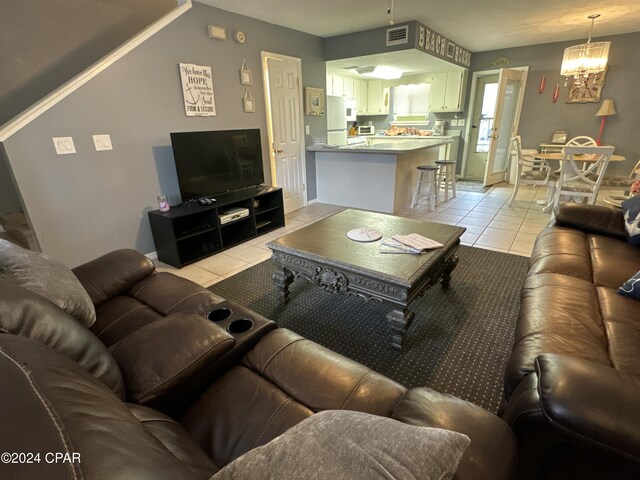 137 Gulf Highlands Blvd, Panama City Beach, FL 32407 - living room featuring light tile patterned flooring, visible vents, and an inviting chandelier