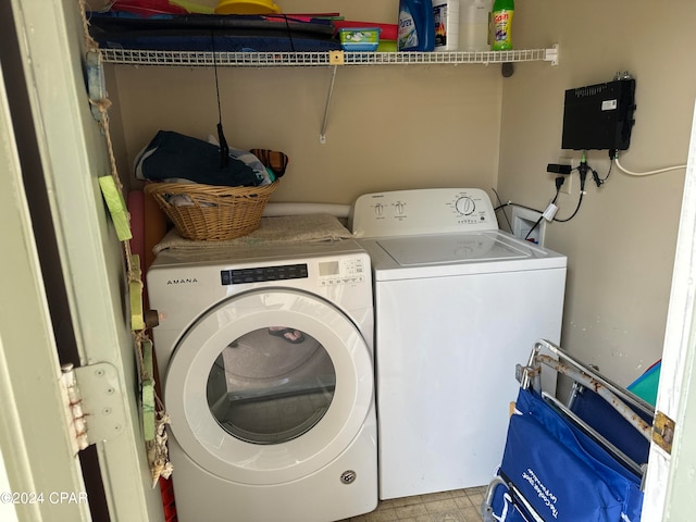 washroom with separate washer and dryer