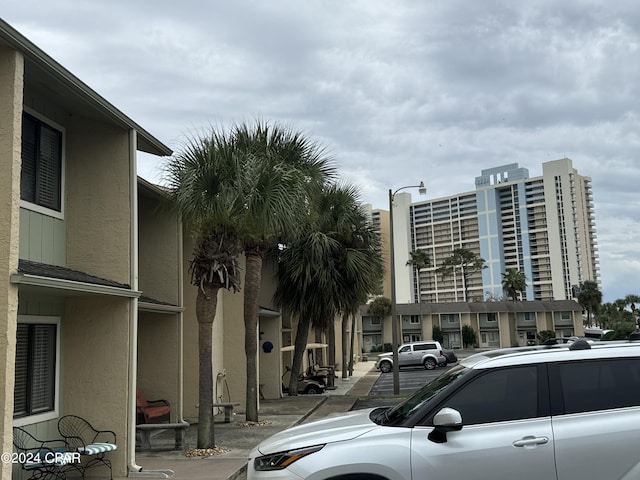 137 Gulf Highlands Blvd, Panama City Beach, FL 32407 - view of building exterior with uncovered parking