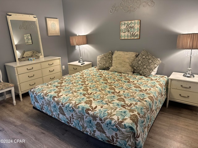 bedroom featuring dark hardwood / wood-style flooring