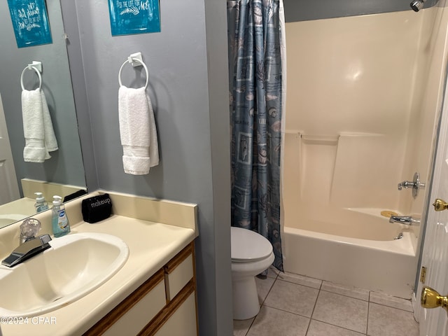 full bathroom with shower / bathtub combination with curtain, tile patterned flooring, vanity, and toilet