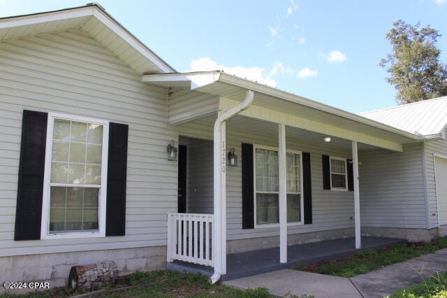 property entrance with a porch