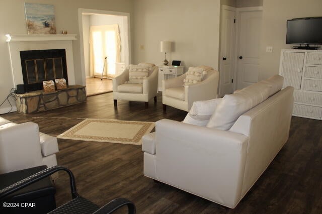 living room with dark hardwood / wood-style floors