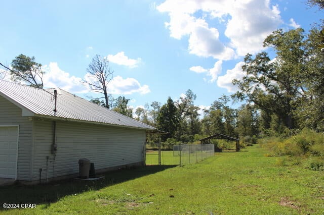 view of yard featuring a garage