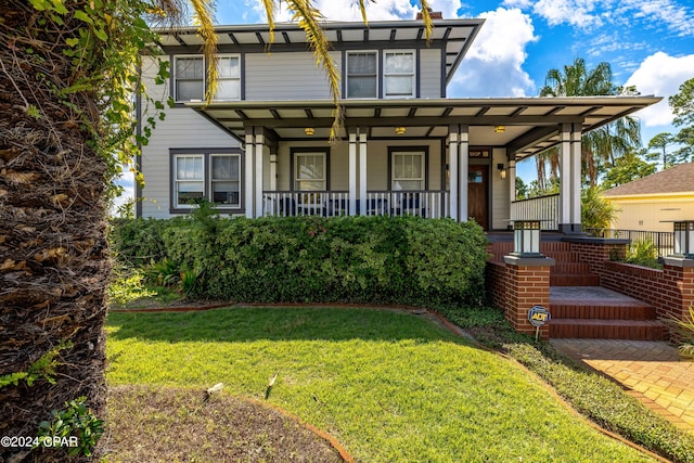 view of front of home featuring a porch and a front lawn