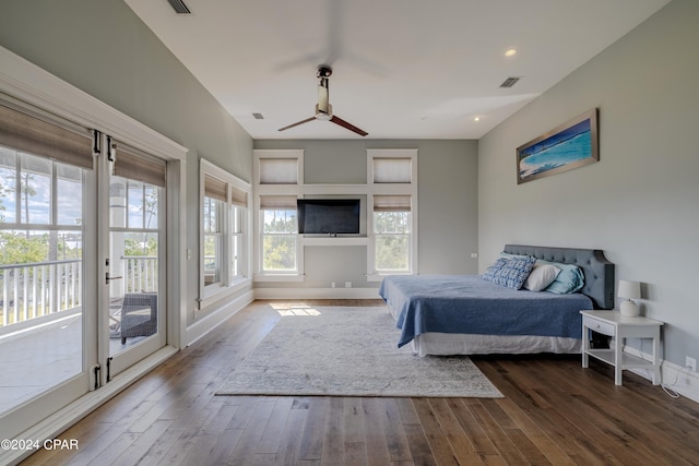 bedroom with wood-type flooring and access to outside