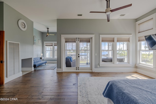 bedroom with ceiling fan, hardwood / wood-style floors, and access to exterior