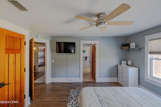 bedroom featuring dark hardwood / wood-style floors and ceiling fan