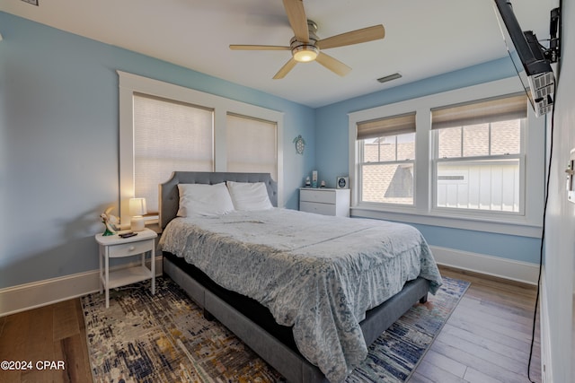 bedroom featuring ceiling fan and hardwood / wood-style floors