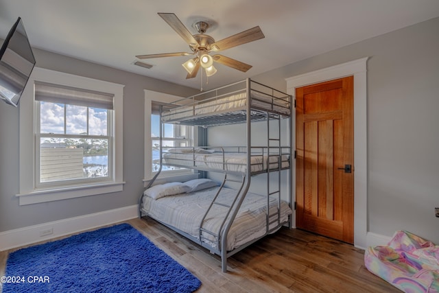 bedroom featuring ceiling fan and hardwood / wood-style flooring