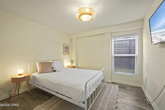 bedroom featuring dark wood-type flooring