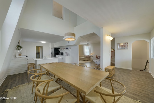 dining space with hardwood / wood-style floors