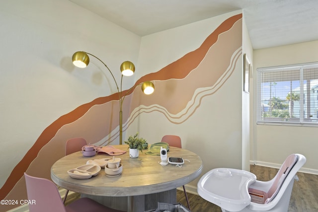 dining area with hardwood / wood-style flooring