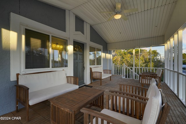 wooden deck featuring ceiling fan and a porch