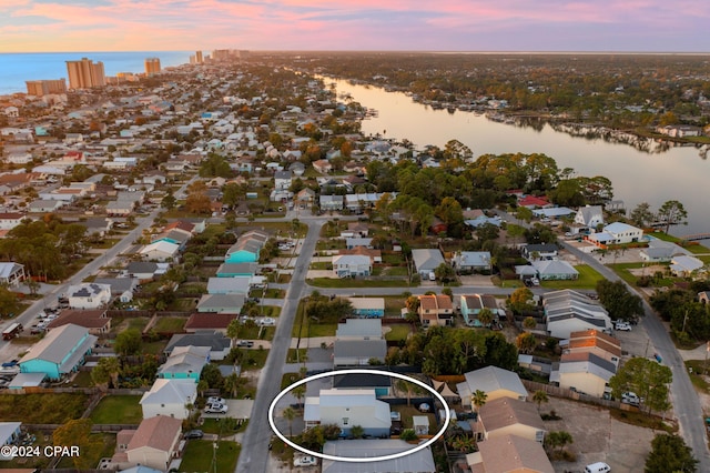 aerial view at dusk with a water view