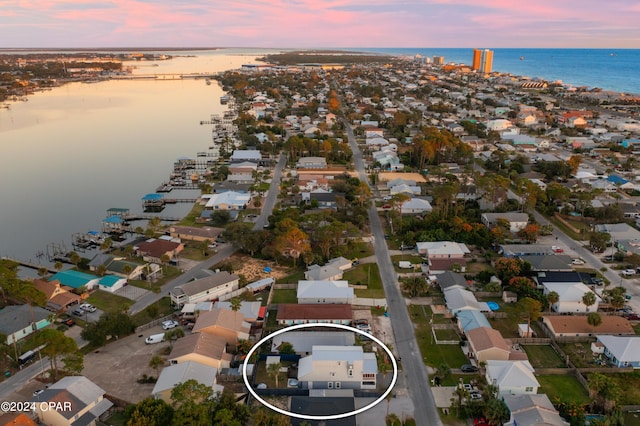 aerial view at dusk with a water view