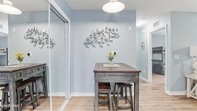 dining space featuring light wood-type flooring