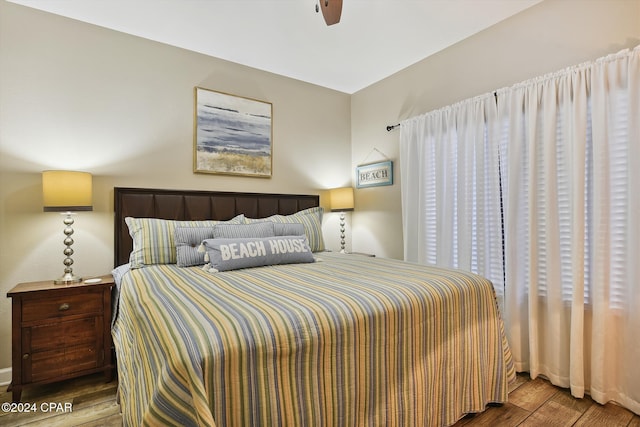 bedroom with ceiling fan and wood finished floors