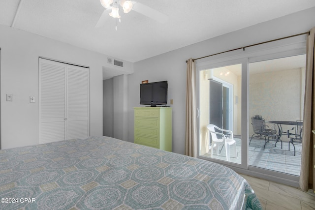 bedroom with ceiling fan and a closet