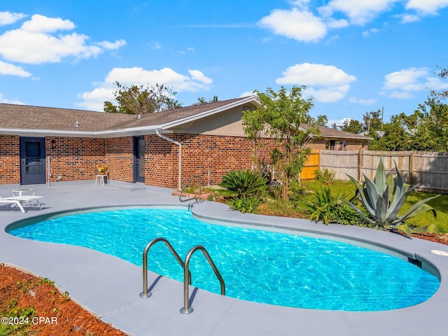 view of pool featuring a patio area