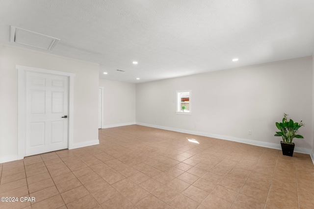 spare room featuring light tile patterned floors