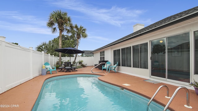 view of pool featuring a fenced in pool, a patio area, and a fenced backyard