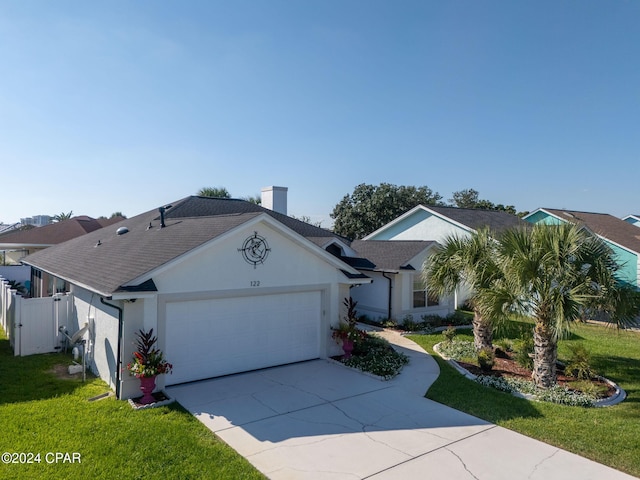 ranch-style home featuring a garage, a front lawn, concrete driveway, and stucco siding