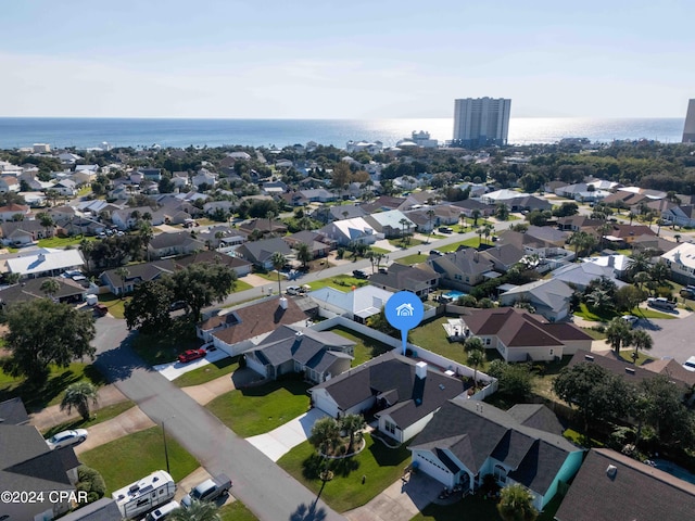 drone / aerial view with a water view and a residential view