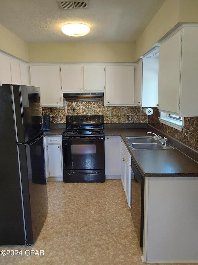 kitchen featuring sink, black appliances, tasteful backsplash, and white cabinetry