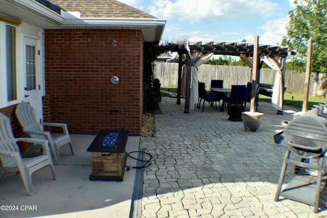 view of patio / terrace featuring area for grilling and a pergola